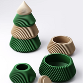 A modular 3D printed Christmas tree with a twisted-fin texture, shown in alternating green and beige tiers.
The stacking Christmas tree deconstructed into four separate bowls or tiers on a white background.
A close-up of the fine, twisted-fin texture on the green modular Christmas tree.