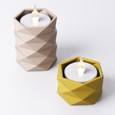 Geometric tealight holder, angled view showing the faceted texture and open top