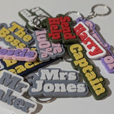 Close-up of raised letter detail on a personalised bag charm