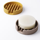 Both exterior style options for the round soap tray shown side by side