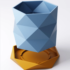 A 3D printed blue equatorial triangle geometric planter with a twisted, faceted design, shown floating above its matching yellow hexagonal drip tray against a white background.