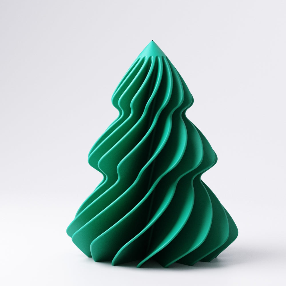 Small christmas tree ornament styled among festive decorations on a mantelpiece