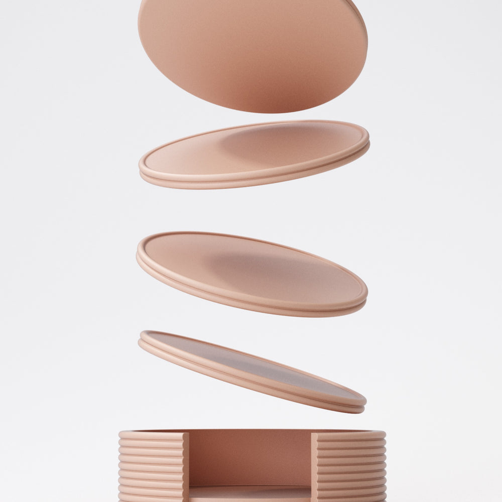 Close-up of stacking coaster set with holder, showing colour detail