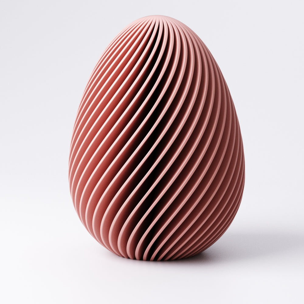 Four sizes of egg decoration shown together from Extra Small to Large