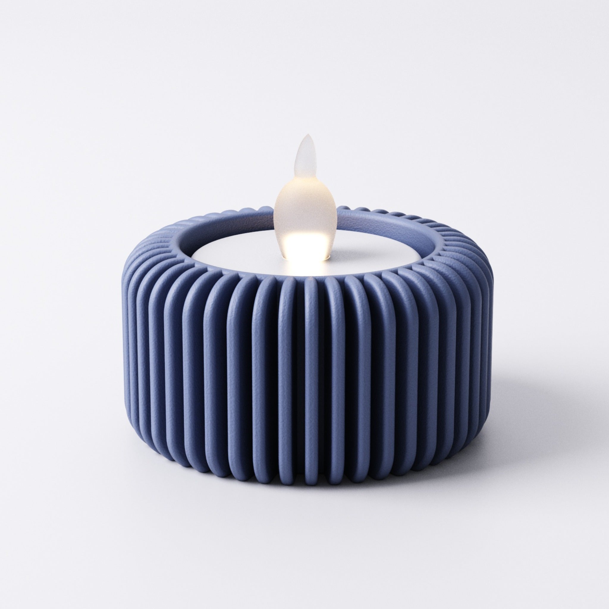 Fin tealight holder, side view on a mantelpiece