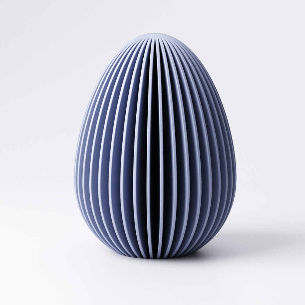 Easter egg decoration with fin texture in Mandarin Orange on a windowsill