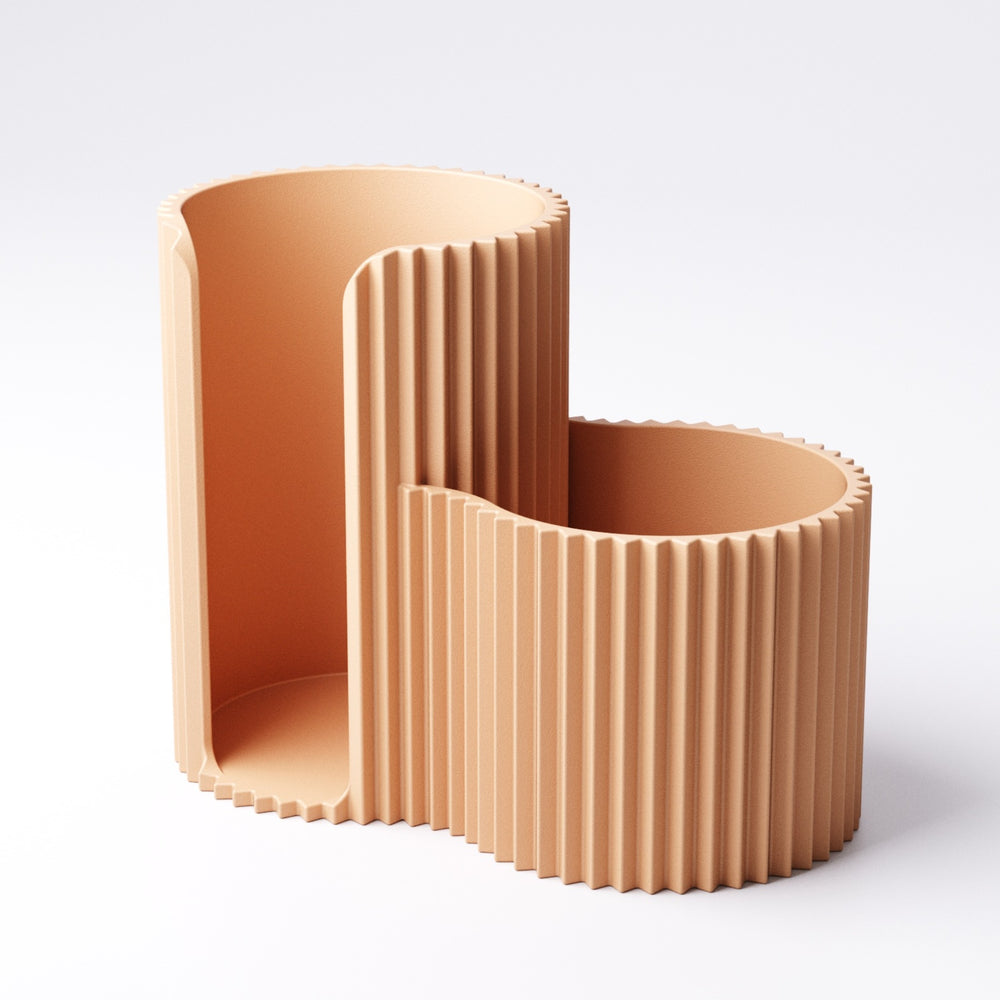 Cotton swab and pad holder in Mandarin Orange on a bathroom vanity