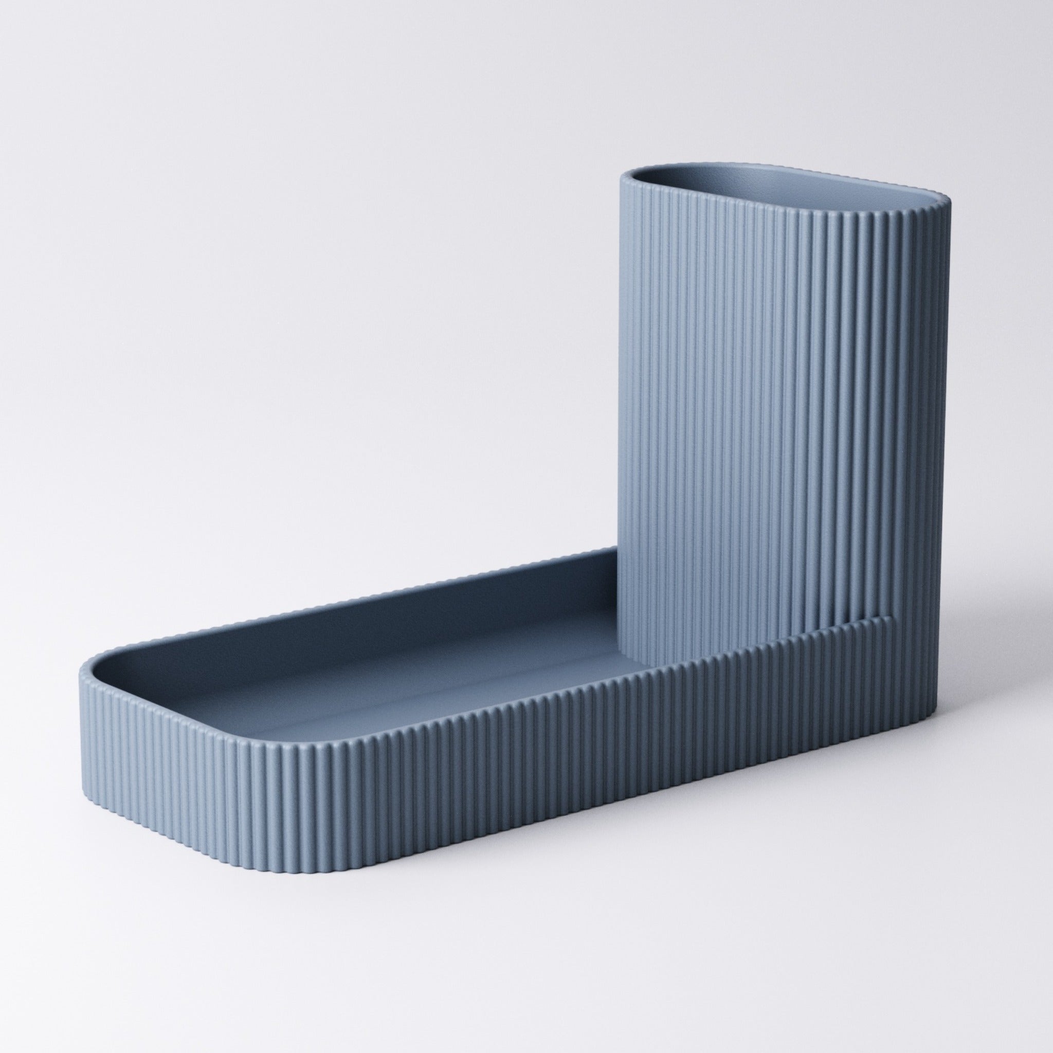 Catchall and pen tray in Mandarin Orange on a desk