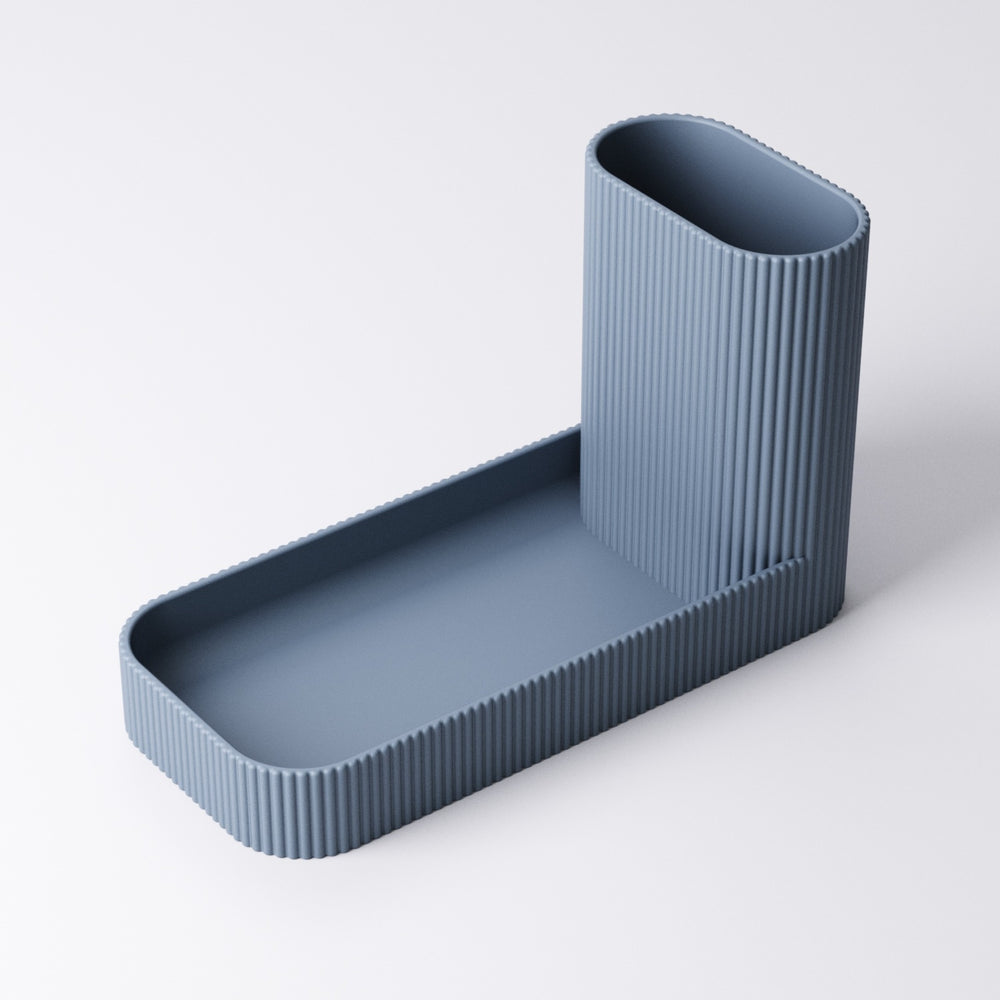 Close-up of the ribbed pen pot texture and catchall tray
