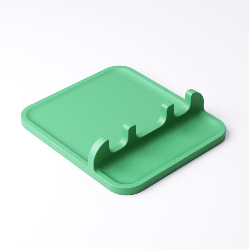 Close-up of the spoon rest's tray section and spoon slots