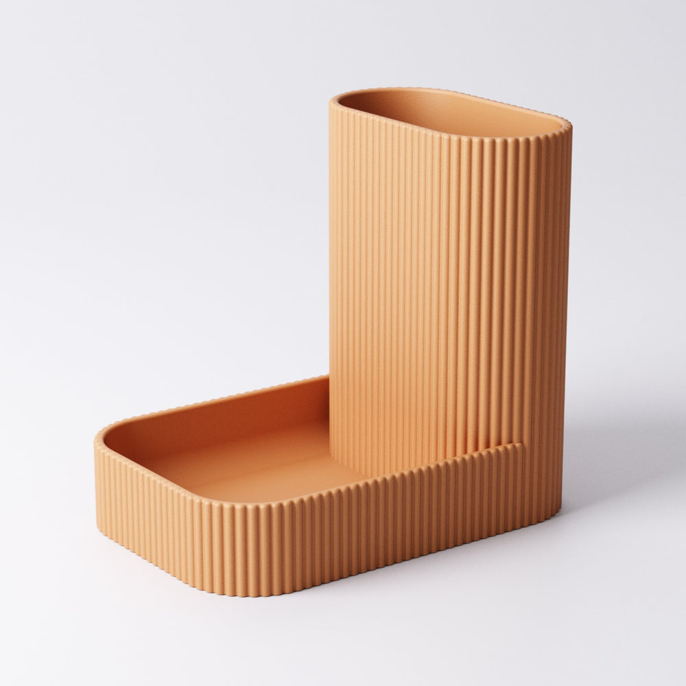 Catchall and pen tray desk organiser in a home office setting