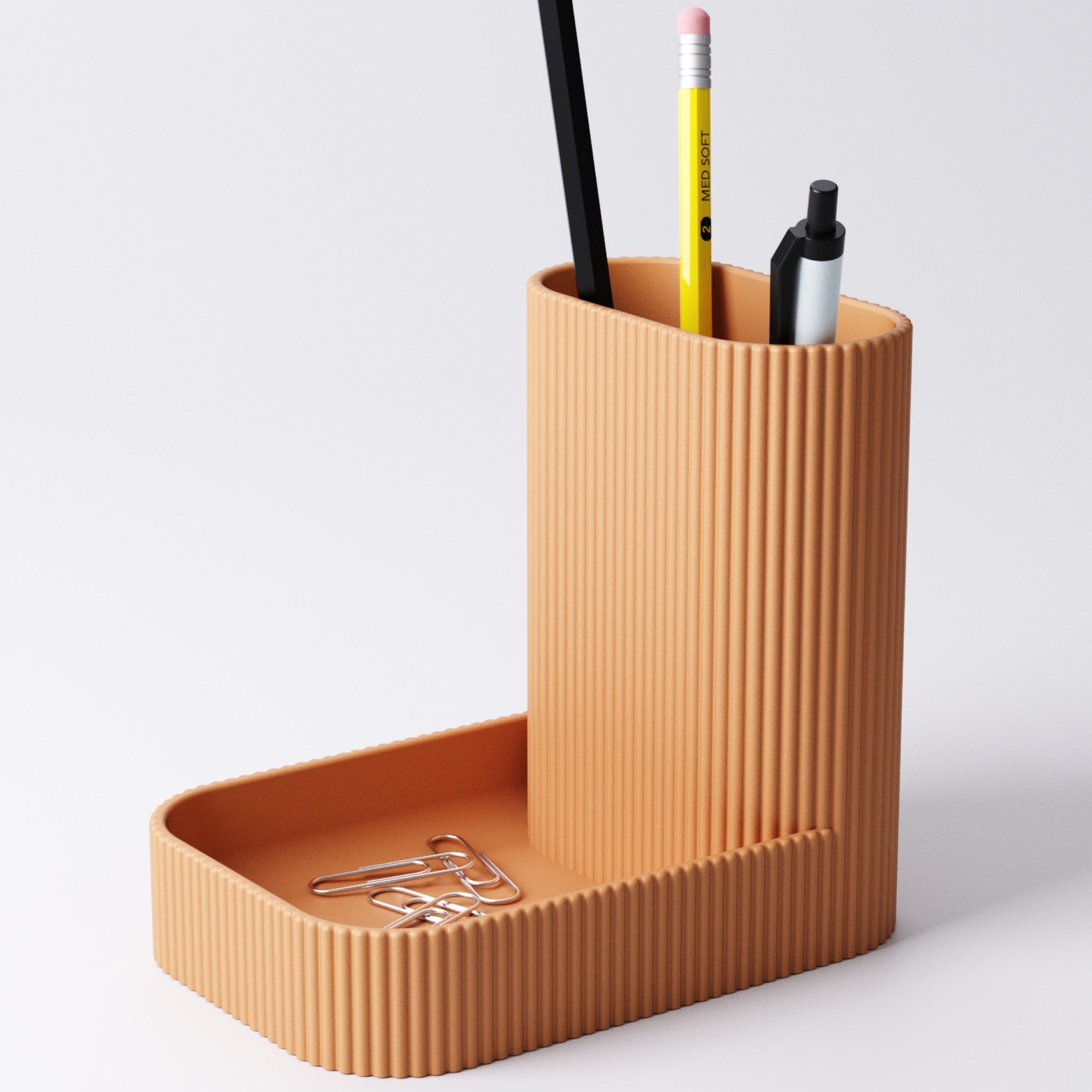 Catchall and pen tray in Ice Blue holding pens and keys