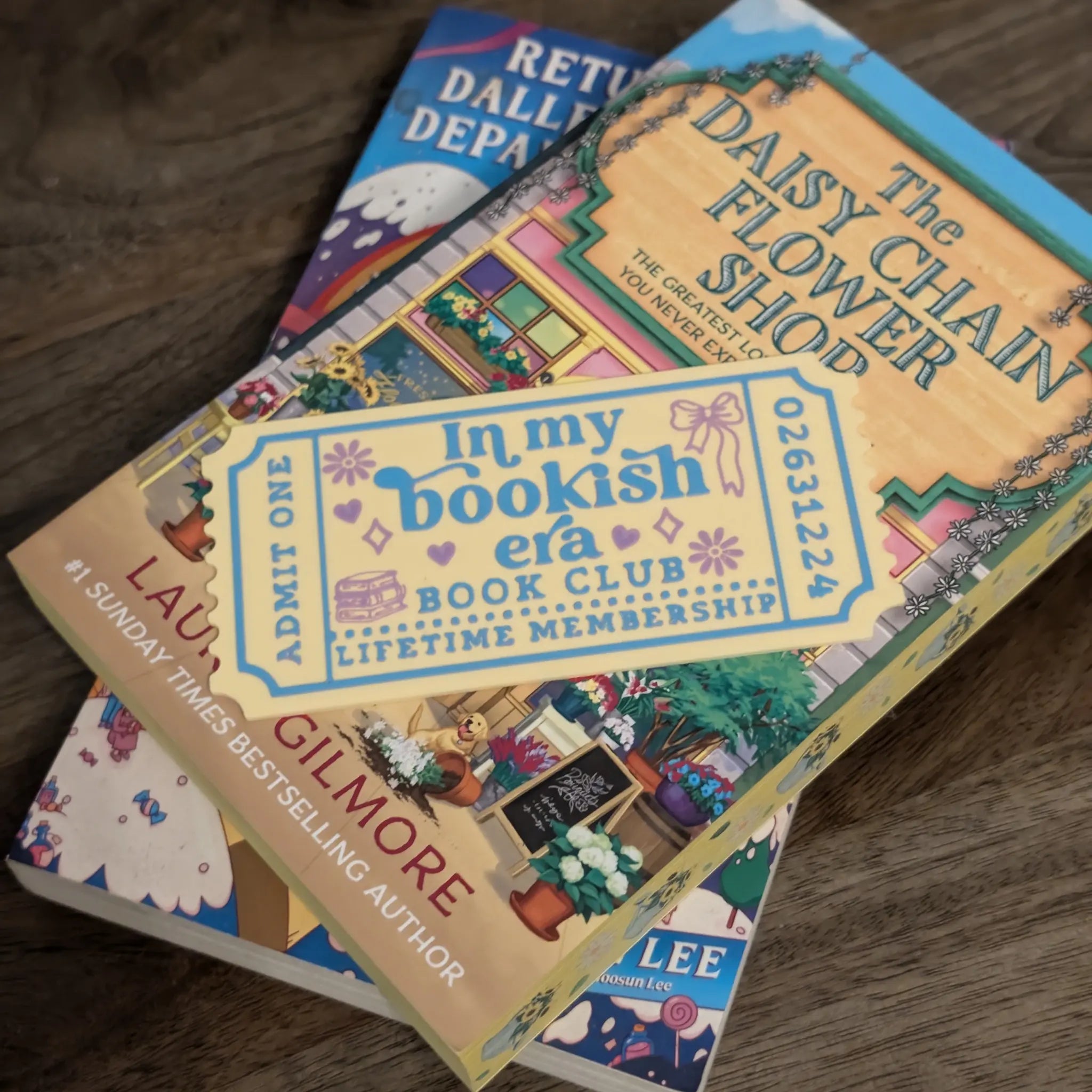 Bookish era bookmark resting on stacked books — personalised colour options available at checkout