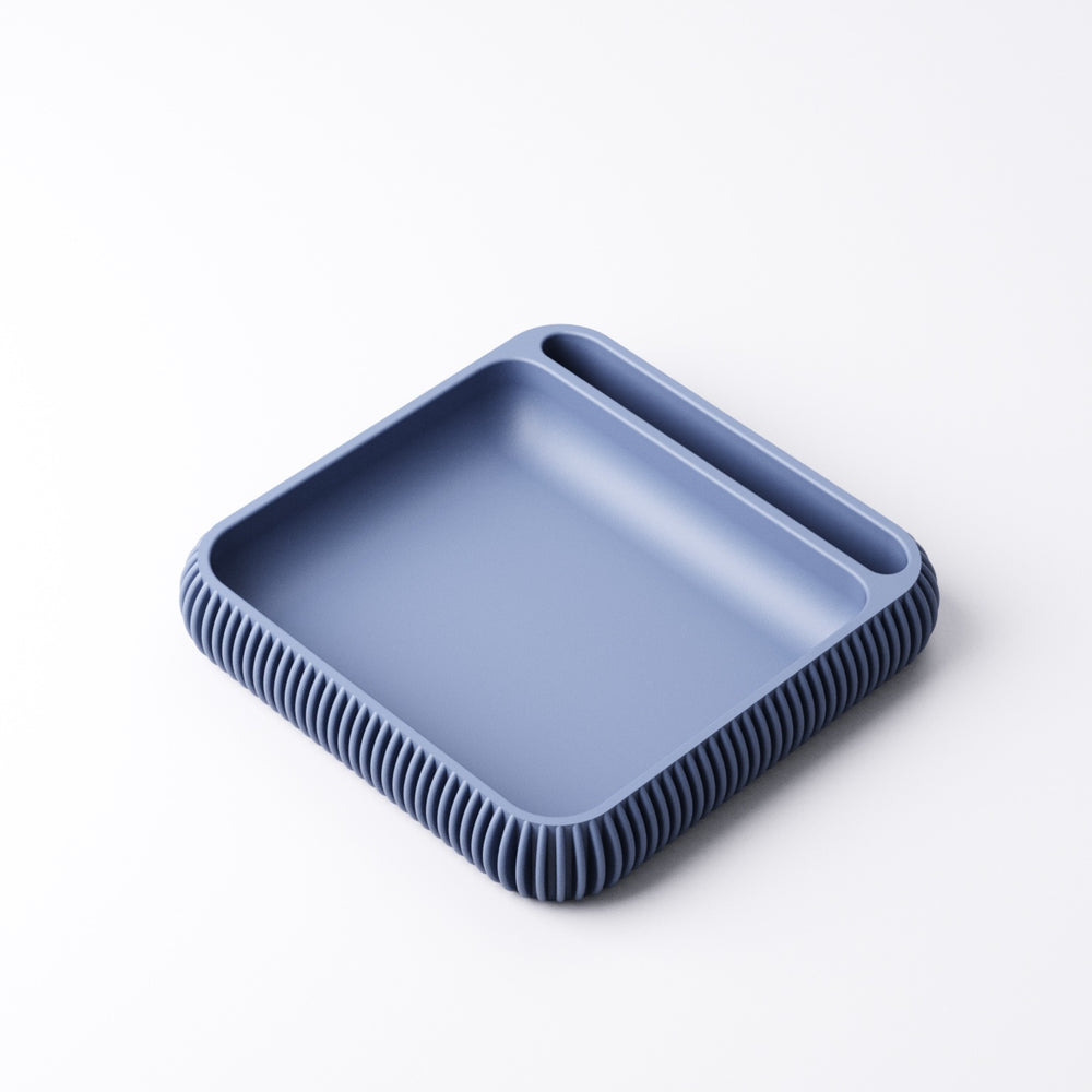 Colourful phone holder tray with finned design on a home office desk