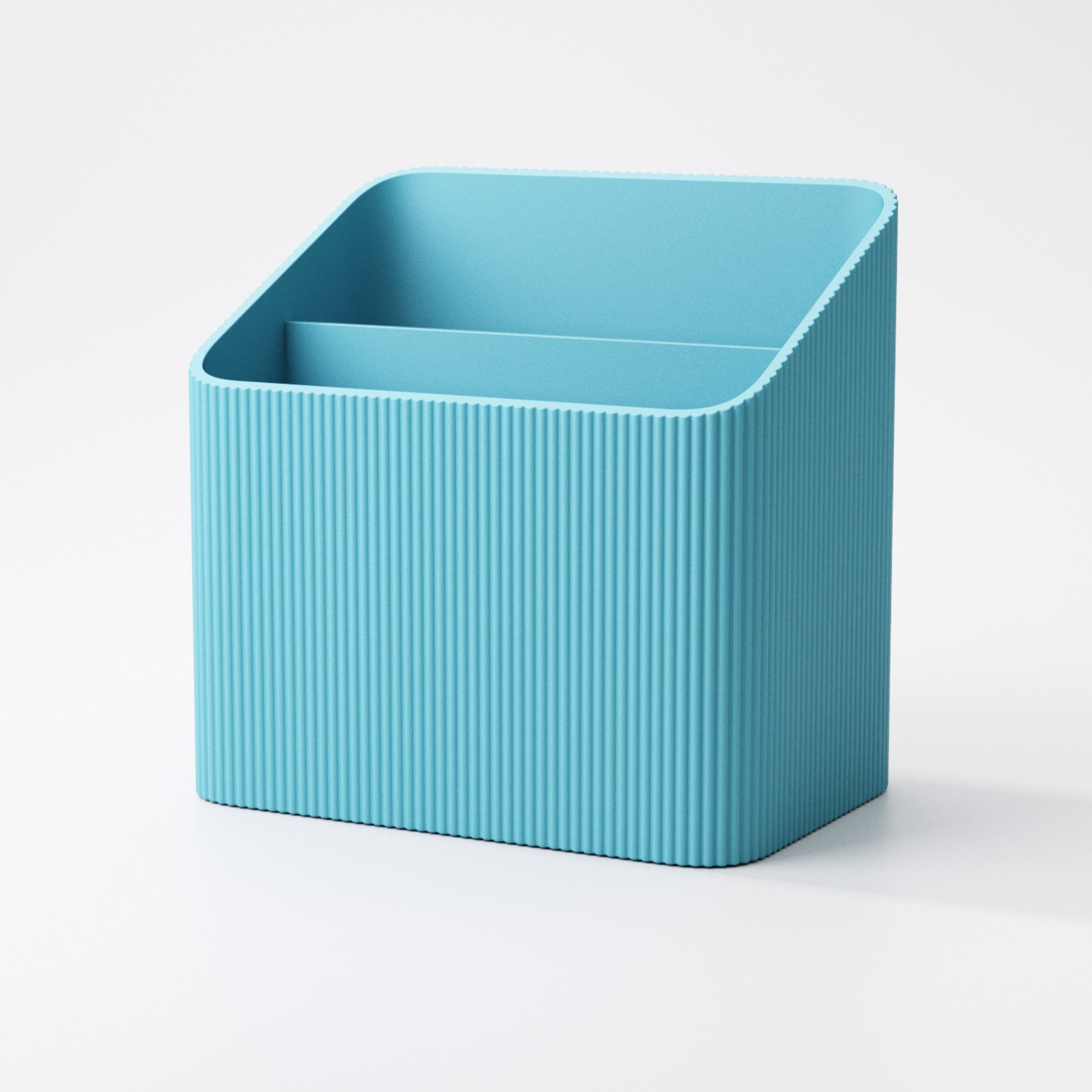 Colourful textured storage box holding a TV remote and soundbar remote upright
