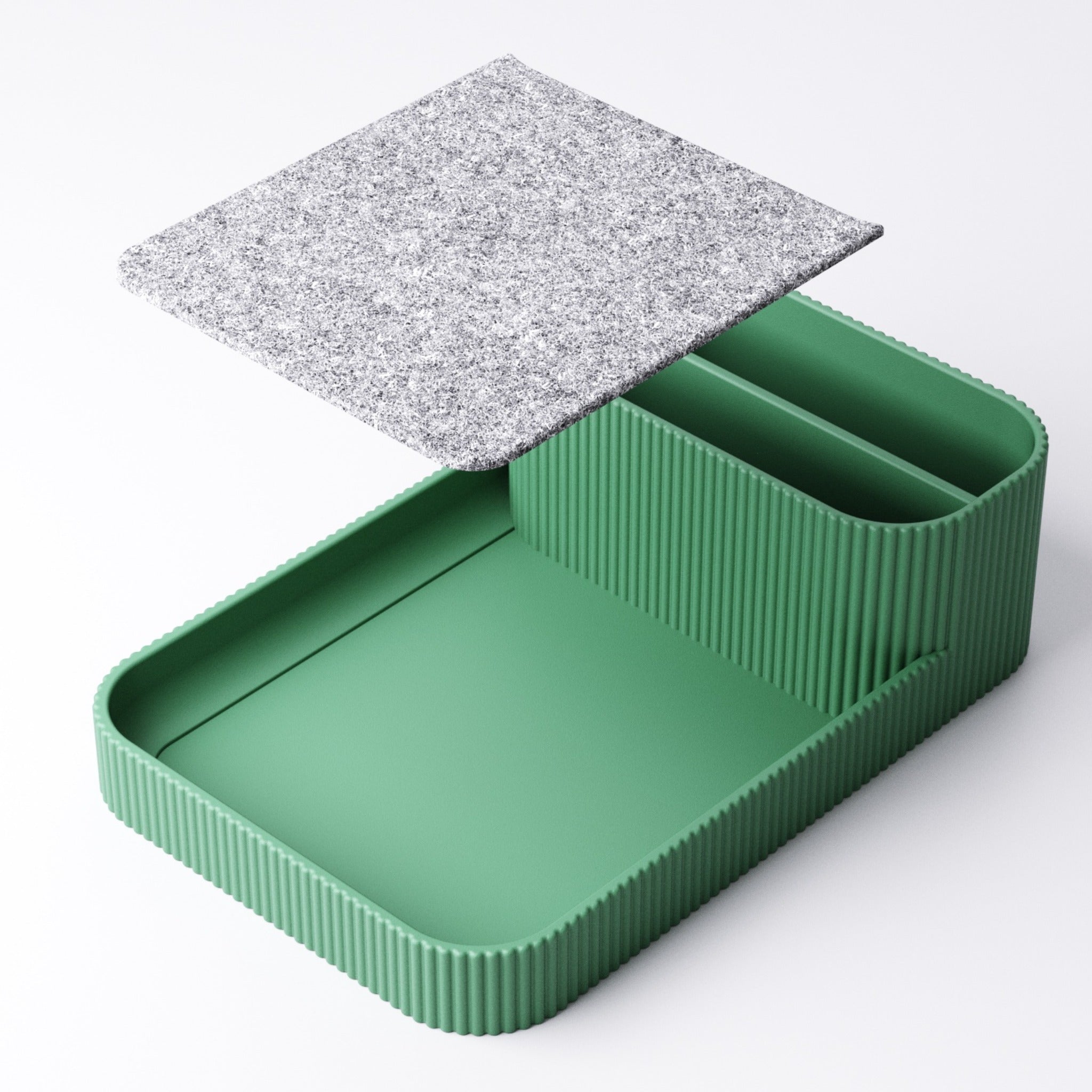 Felt-lined tray lifted out of the remote holder to show the recess