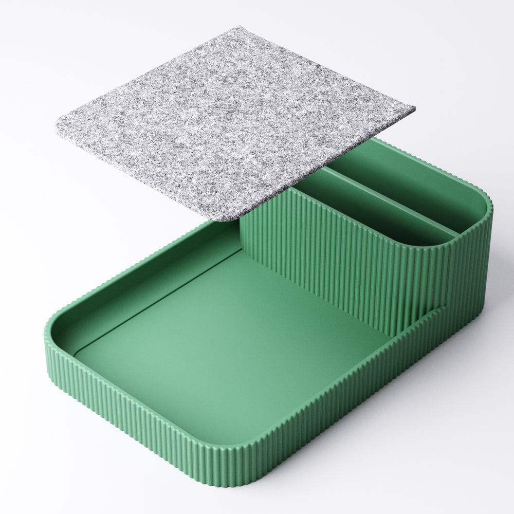 Felt-lined tray lifted out of the remote holder to show the recess