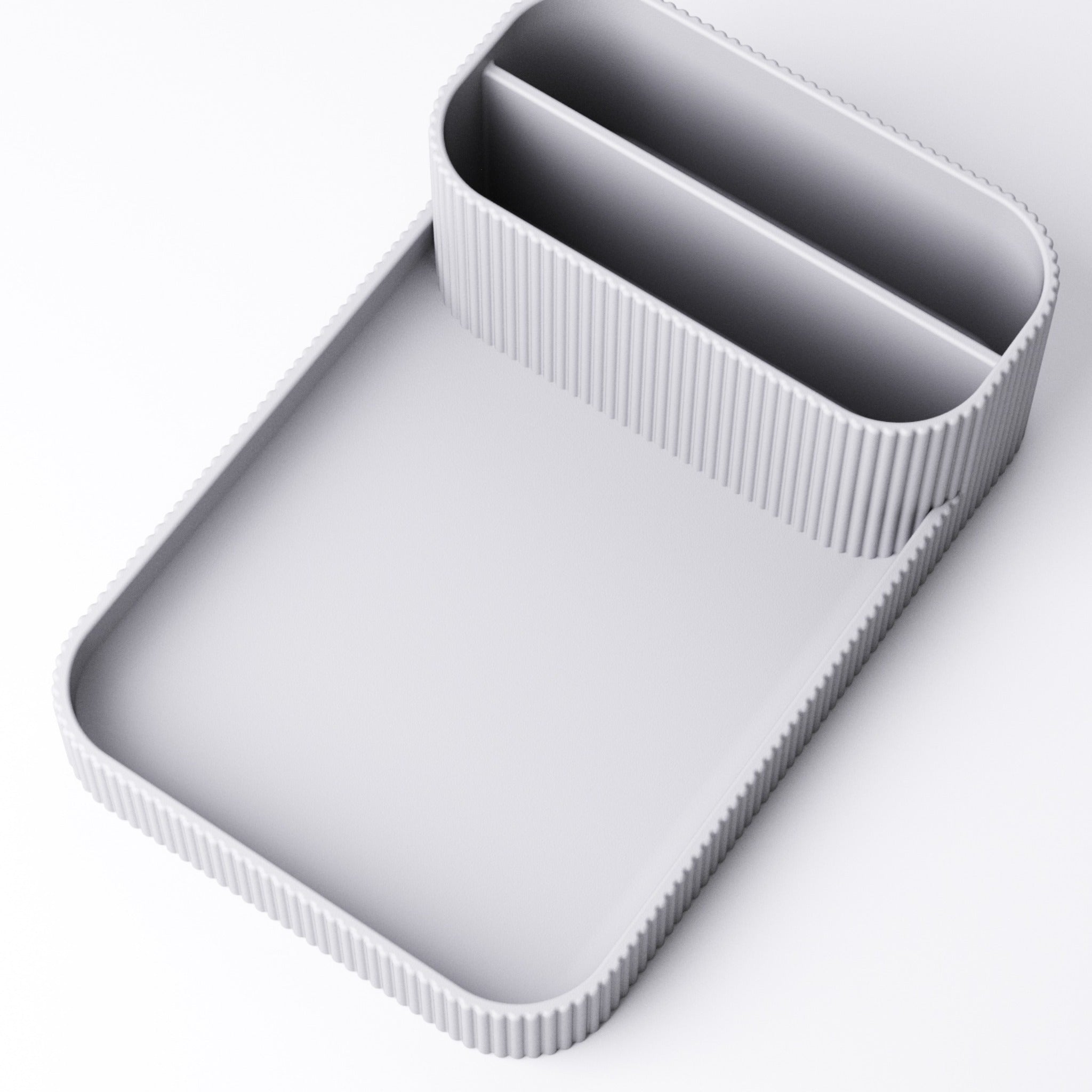 Remote holder with tray in grey, holding two remotes
