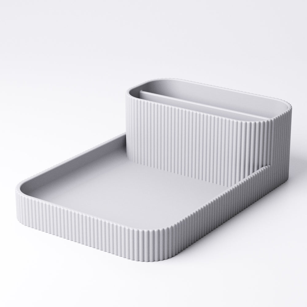 Remote holder and tray viewed from above showing both compartments