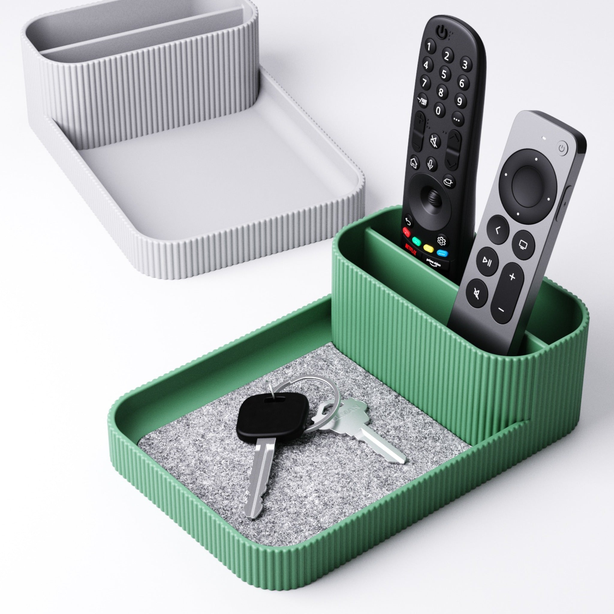 Remote control holder with tray angled to show the ribbed side wall