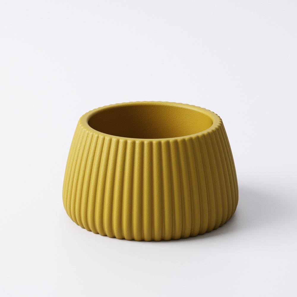 Mustard yellow ridged tealight holder, Small size, angled view showing the fin-textured ridges and open top