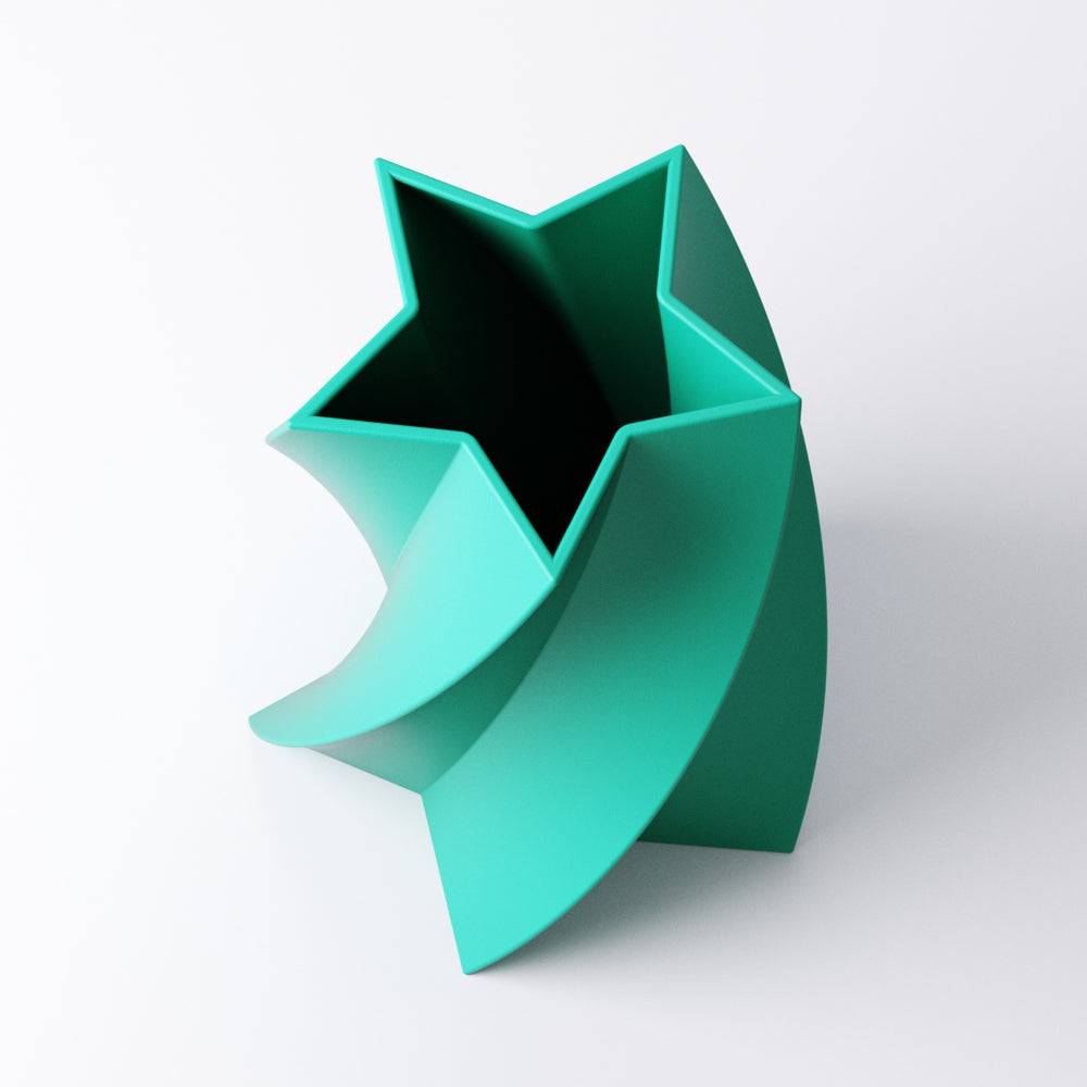 Star vase with spiralling star-shaped silhouette on a bedroom shelf