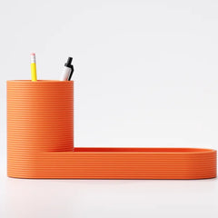 Close-up of the tiered desk organiser's storage compartments on a home office desk