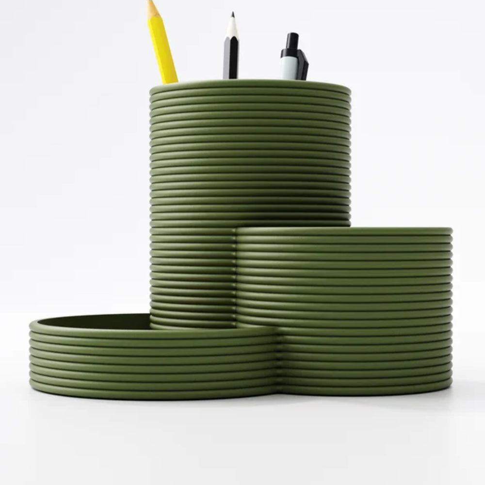 Tiered desk organiser with three round pen pots in a bold colour