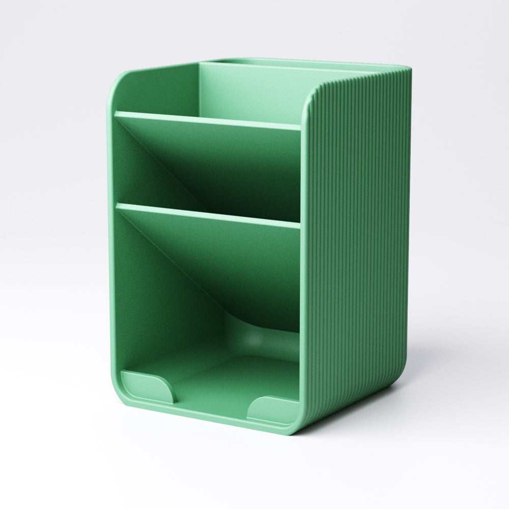 Tiered pen holder small version shown next to a laptop on a tidy desk
